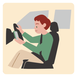 運転しながら、携帯を見る男性
